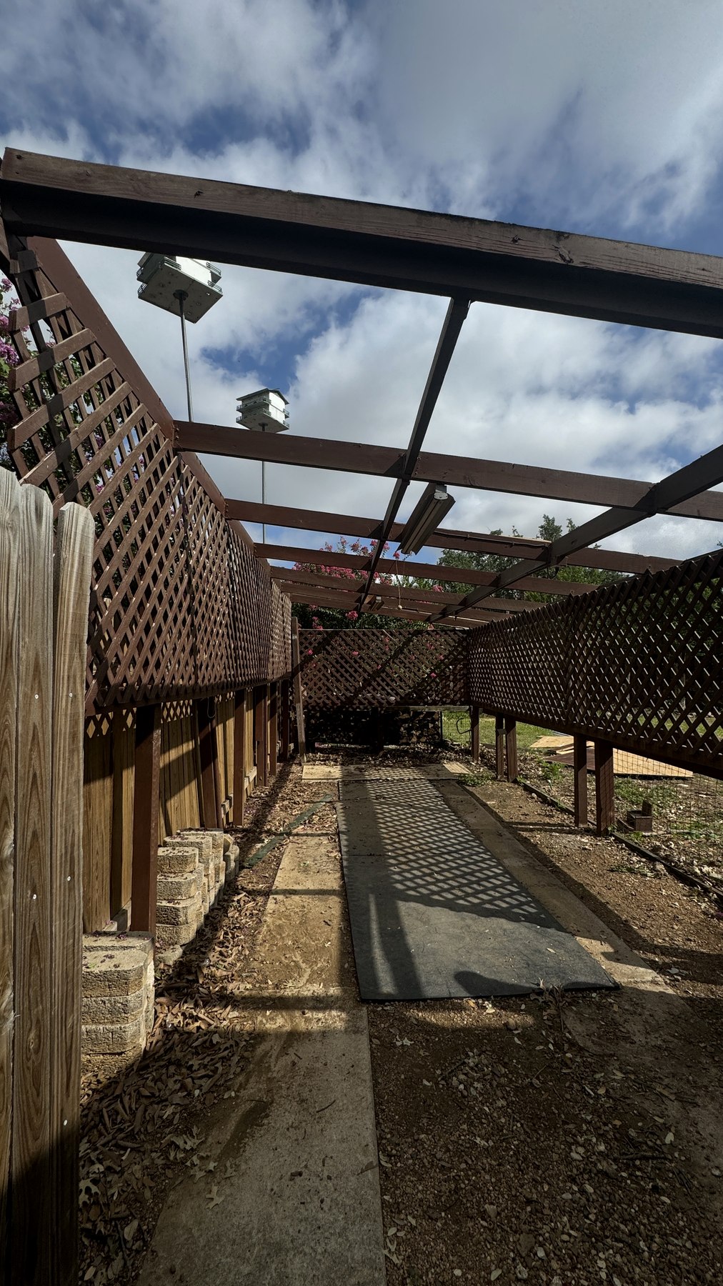 Carport with the roof removed and frame exposed