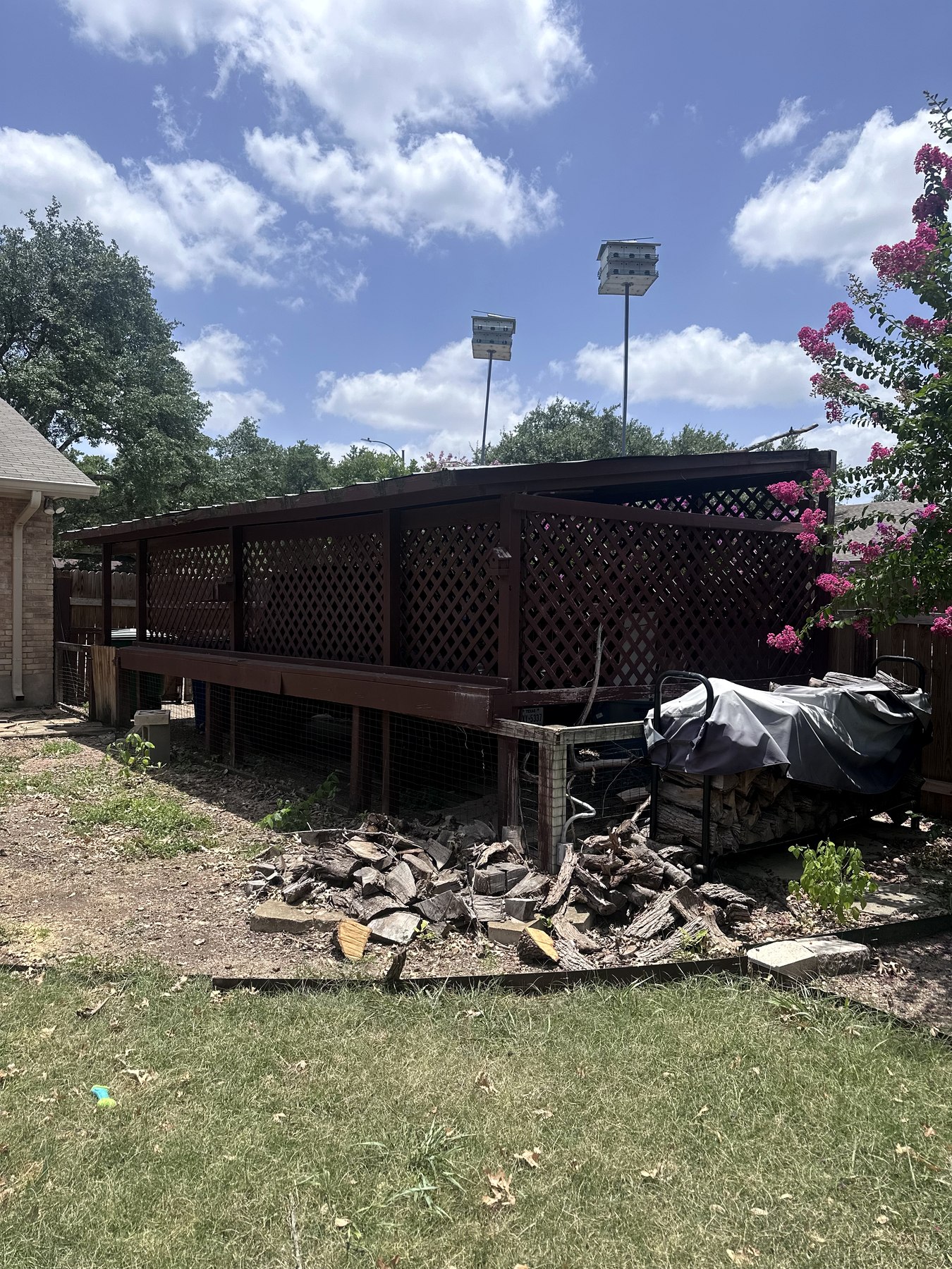 Second view of the intact carport before demolition