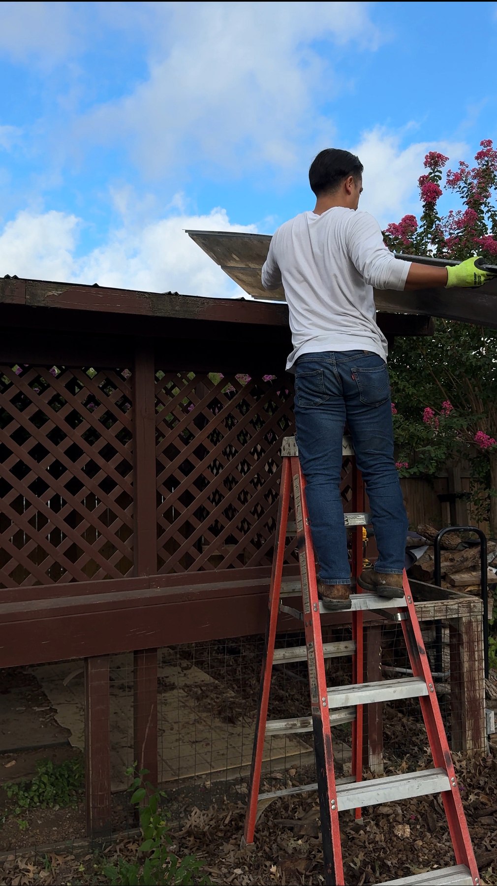 Clearsite owner pulling sheet metal from the carport roof